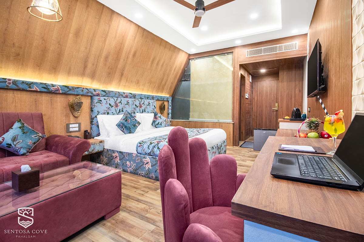 Guest room with lounge seating and work desk
